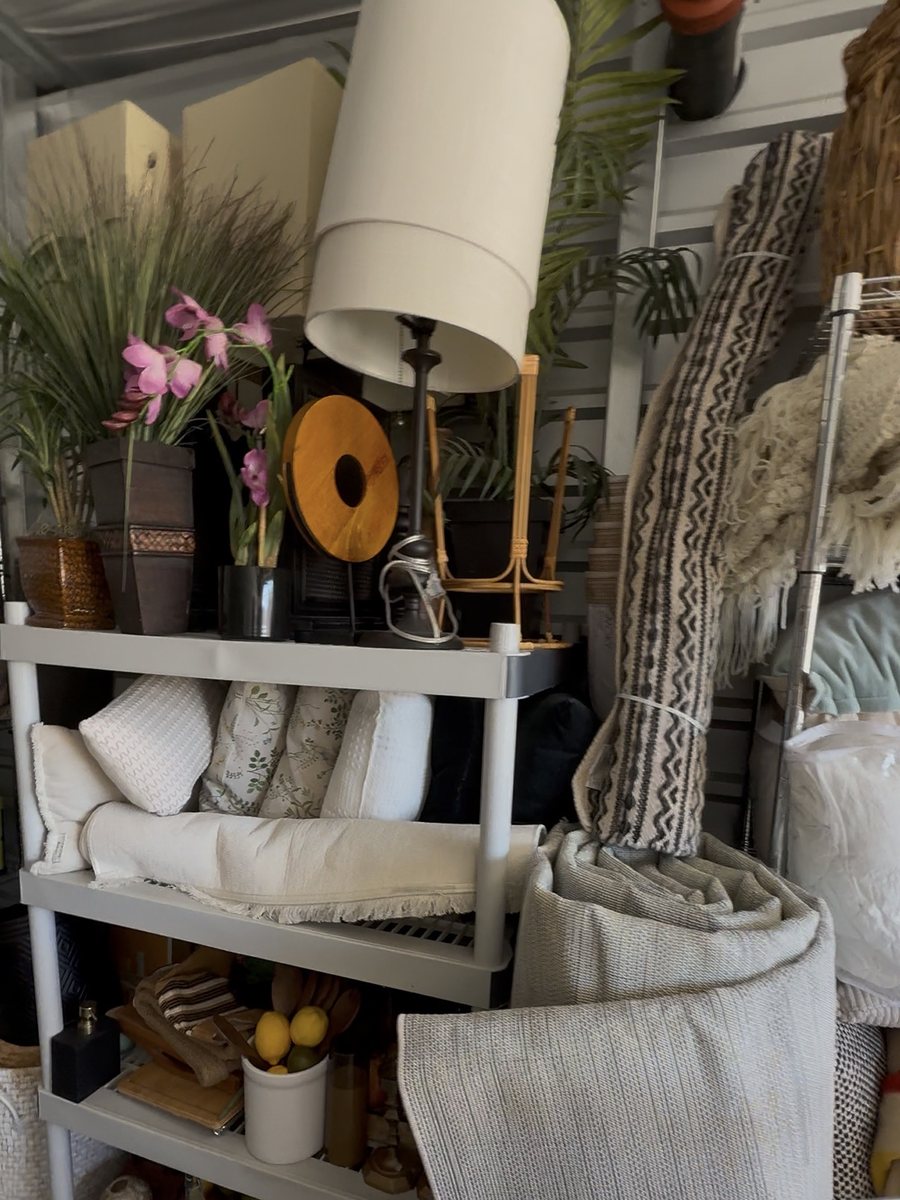 Curated staging inventory — textiles, lighting, and decor ready for placement